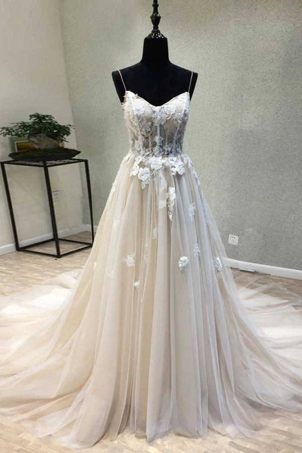 Elegant A-line wedding dress with spaghetti straps and lace appliques, front view.