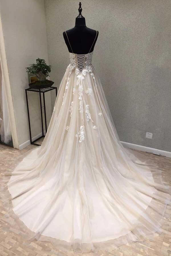 Back view of an A-line wedding gown featuring delicate lace details.