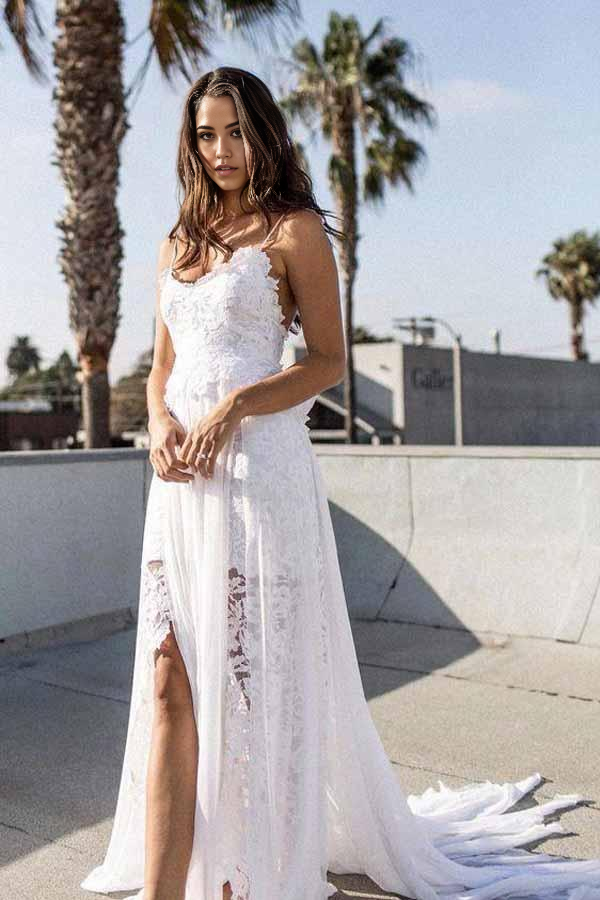 Back view of white lace chiffon A-line wedding dress with flowing skirt.