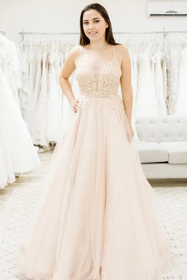 Elegant A-line wedding dress with V-neck, spaghetti straps, and illusion plunging detail.