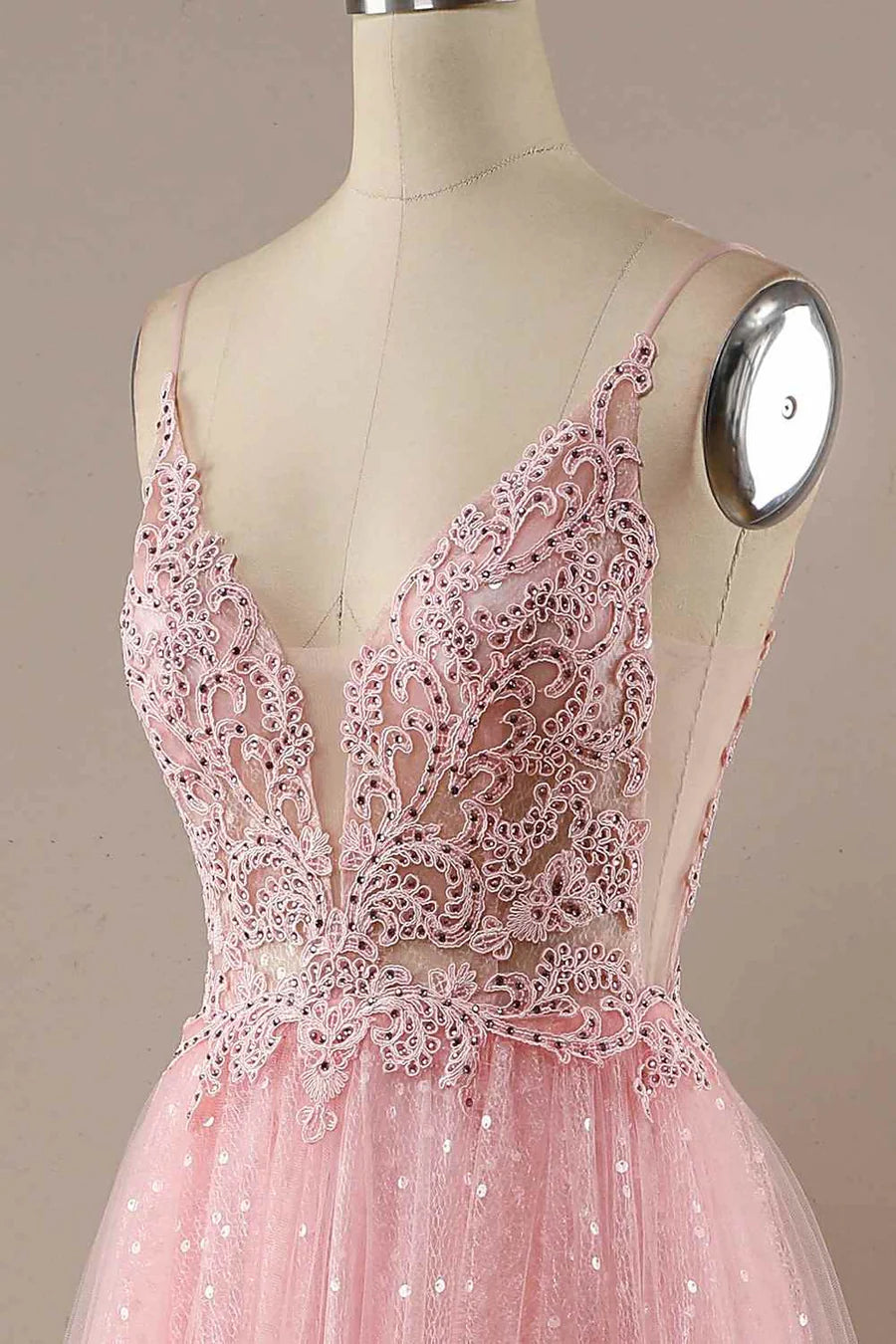 Close-up of the sparkly tulle and applique details on the prom dress.