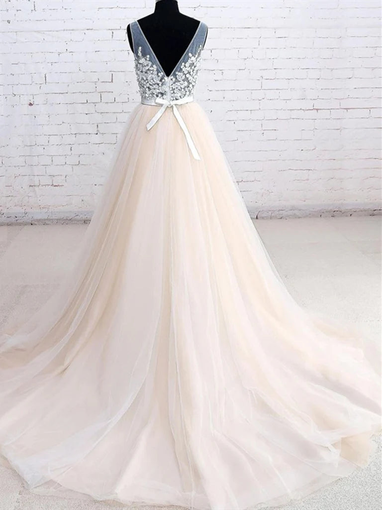 Side view of A-line V-neck tulle floral ball gown with flowing skirt.