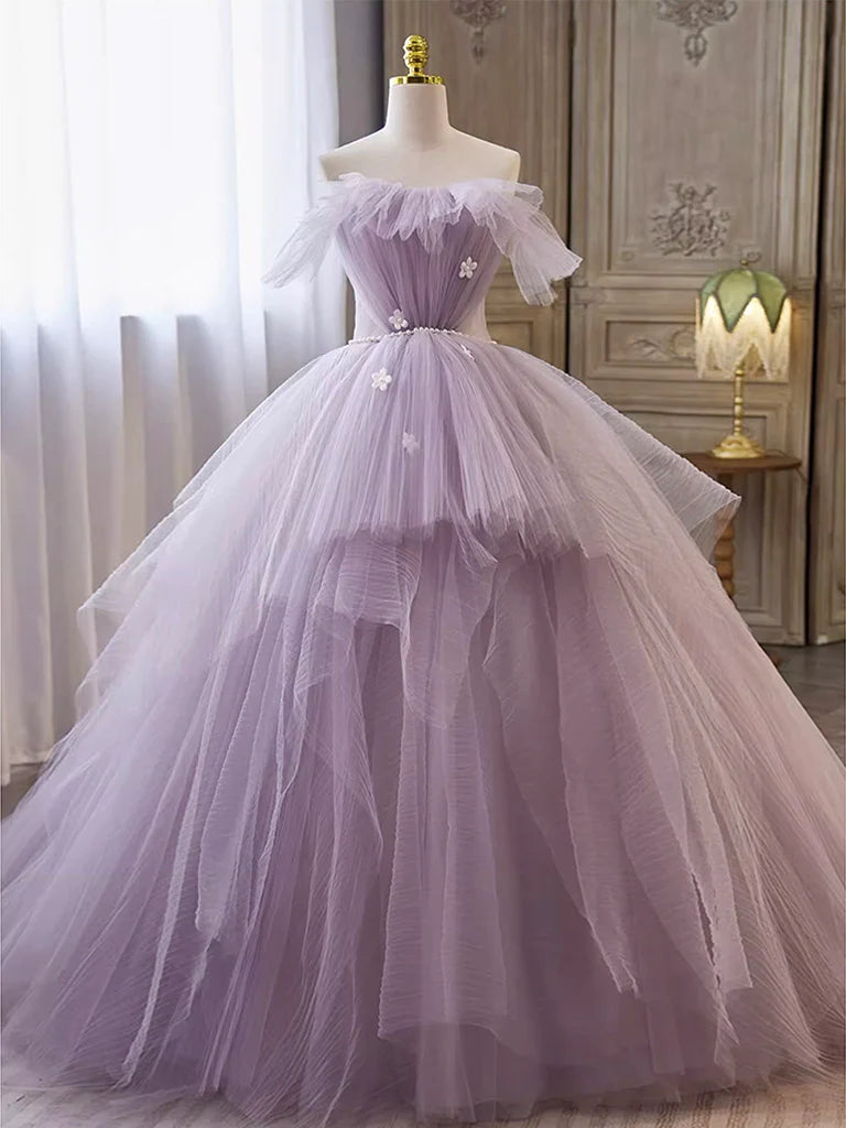 Elegant A-line tulle prom gown with V-neck and spaghetti straps.