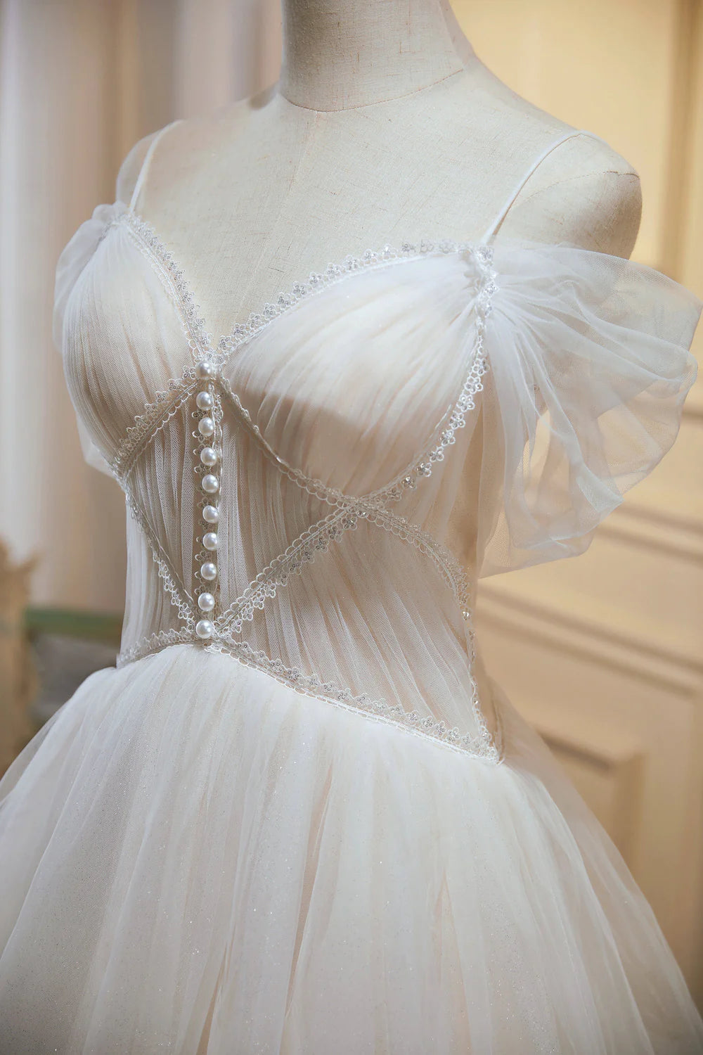 Side view of the elegant A-line V-neck tulle dress.