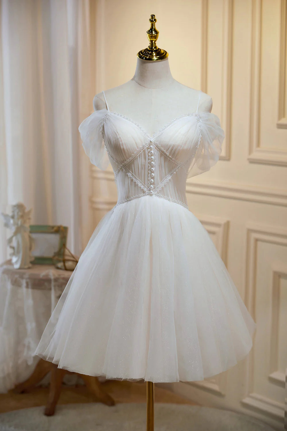 Close-up of the delicate tulle fabric on the A-line V-neck dress.