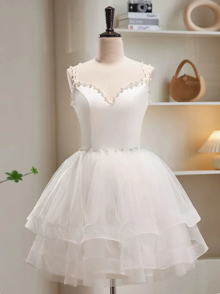 Model wearing an elegant A-line V-neck short tulle homecoming dress.