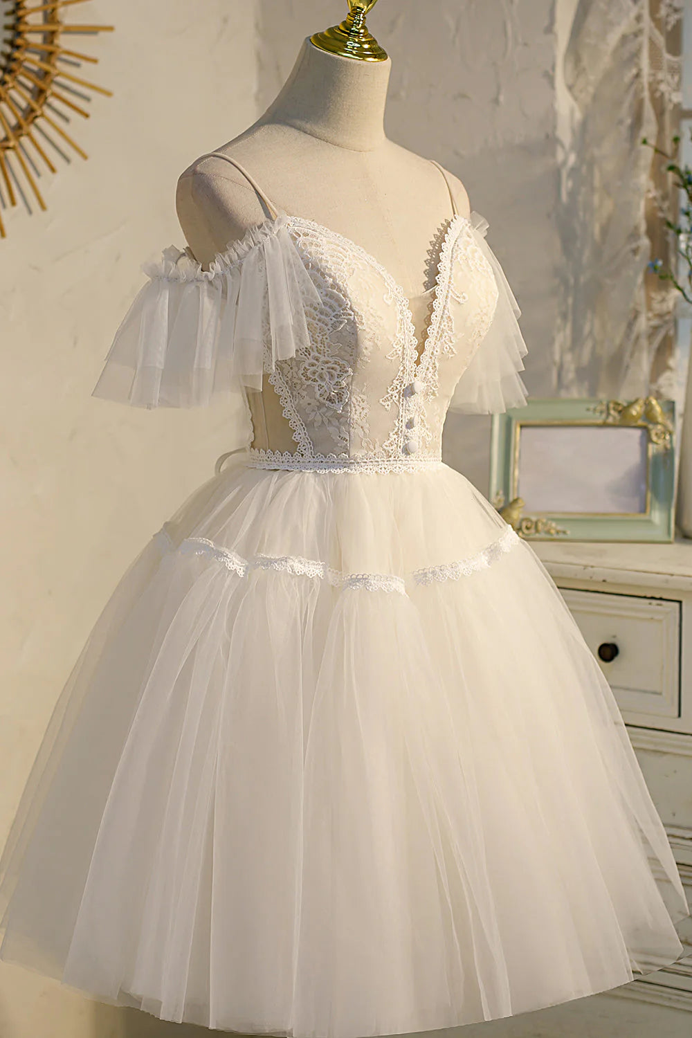 Close-up of the V-neckline and flowing tulle fabric on the homecoming dress.