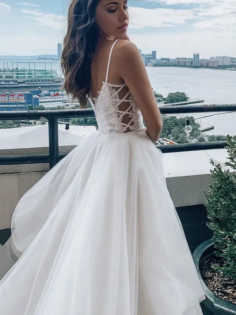 Formal white lace prom dress with A-line silhouette and V-neck.