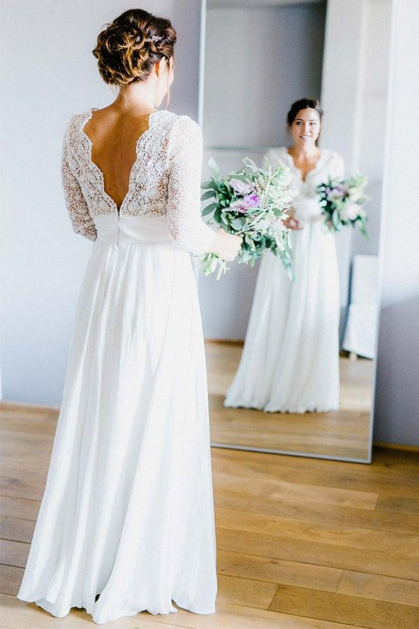 Elegant A-line V-neck wedding dress with 3/4 lace sleeves.
