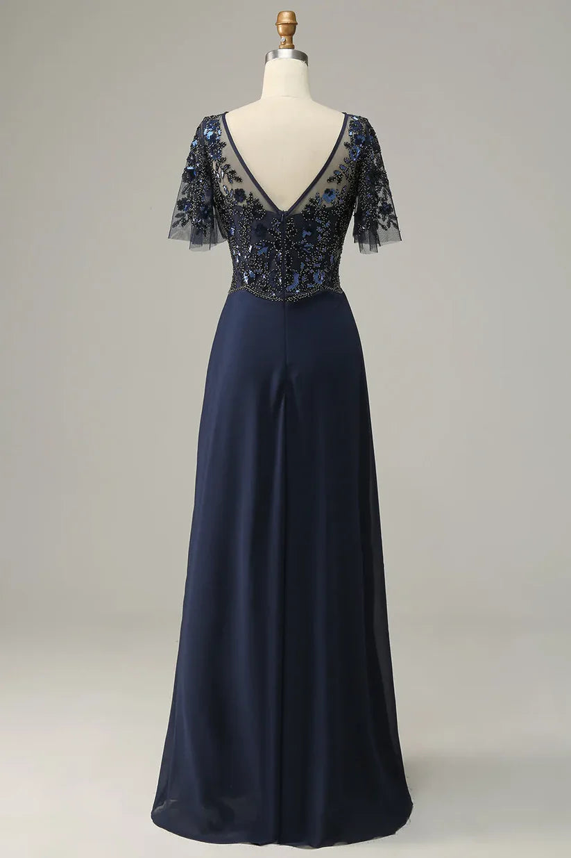 Side view of a woman in a long A-line sequin dress with appliques.