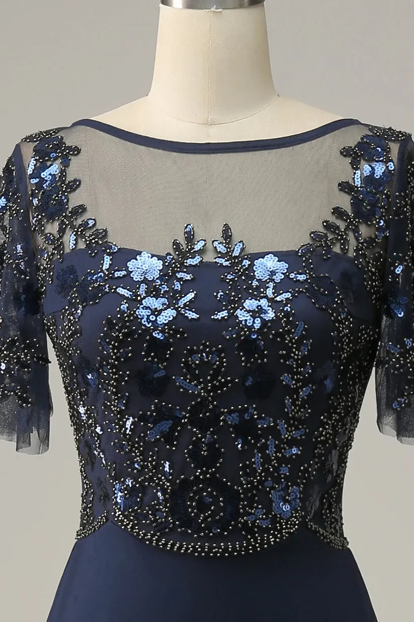 Close-up of the sequin and applique details on the A-line mother of the bride dress.