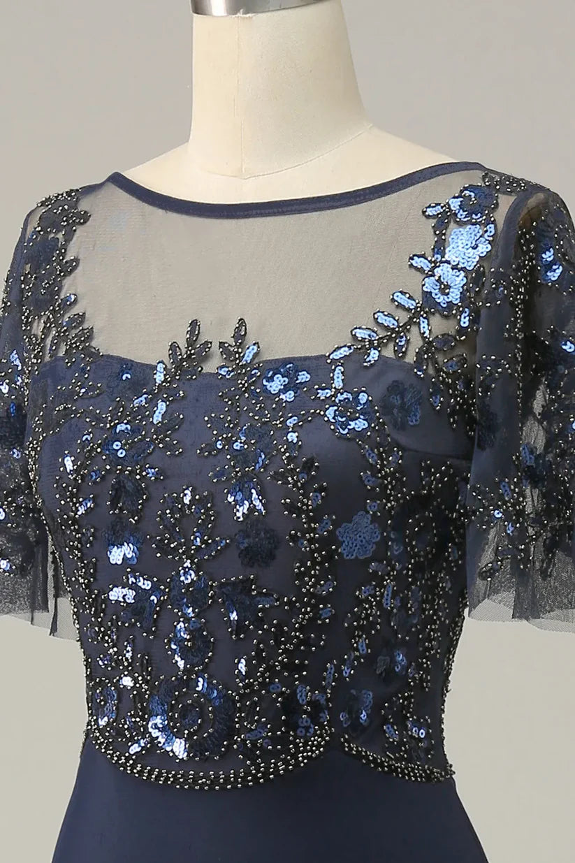 Woman posing in the long V-neck A-line sequin dress, showing its full silhouette.