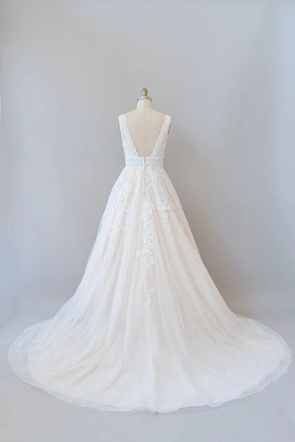 Back view of the A-line wedding dress showcasing the backless design.