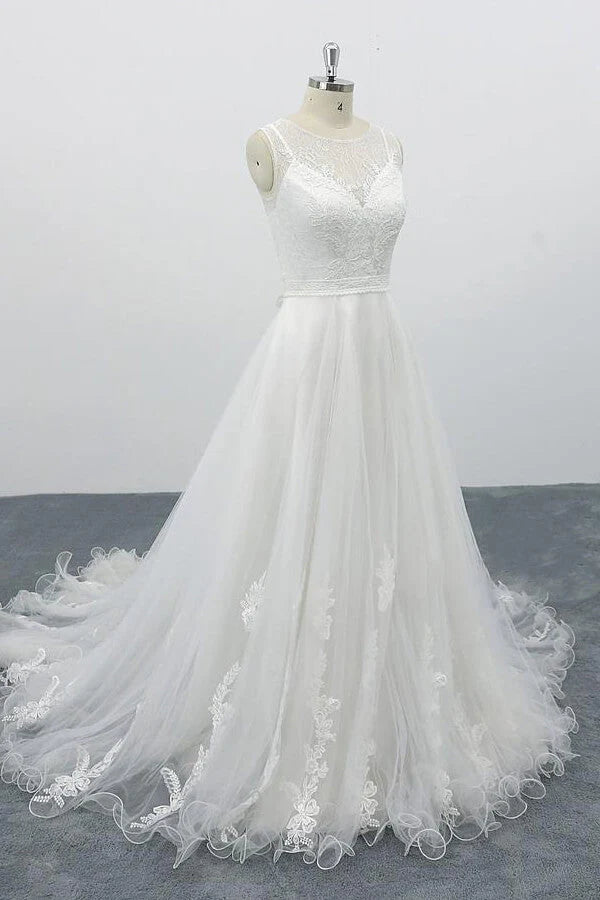 Side view of the A-line wedding dress with appliques and flowing tulle.