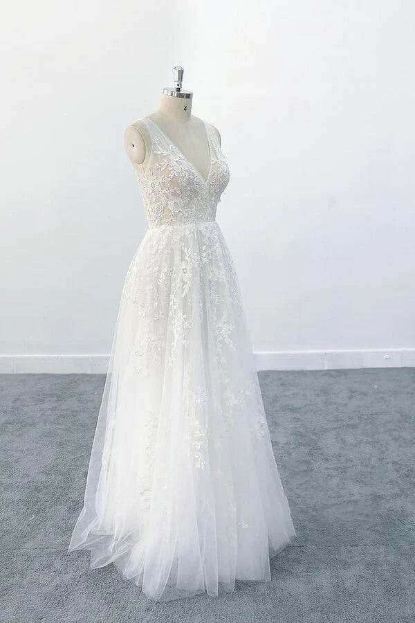 Full length view of a V-neck backless wedding dress.