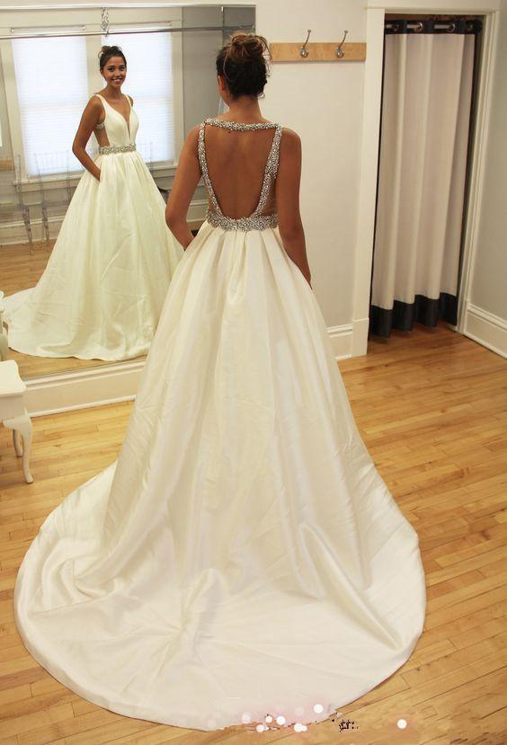 Elegant A-line V-neck beaded sleeveless wedding dress with a sweep train.