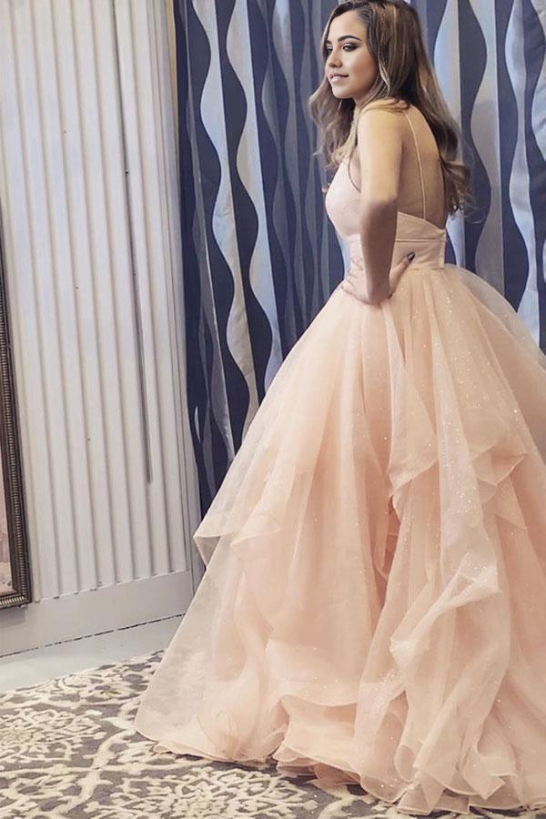 Elegant champagne A-line dress with V-neck and ruffled skirt.