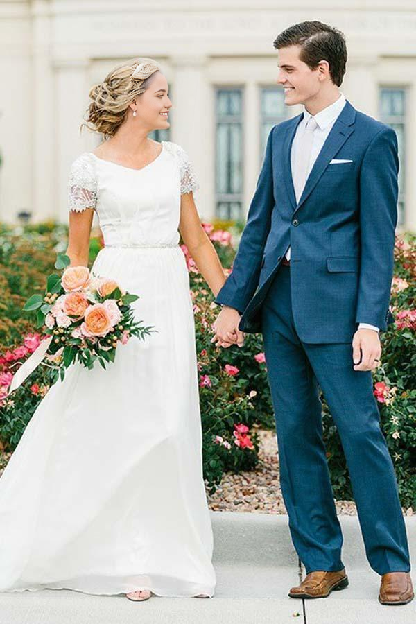 Back view of the A-line V-neck chiffon wedding dress with flowing skirt.