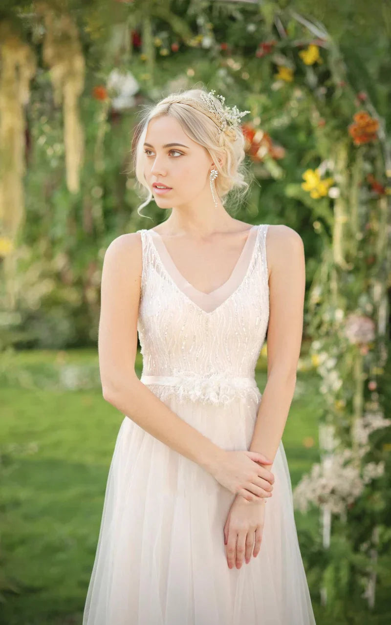 Back view of the A-line wedding dress, highlighting the flowing chiffon and tulle skirt.