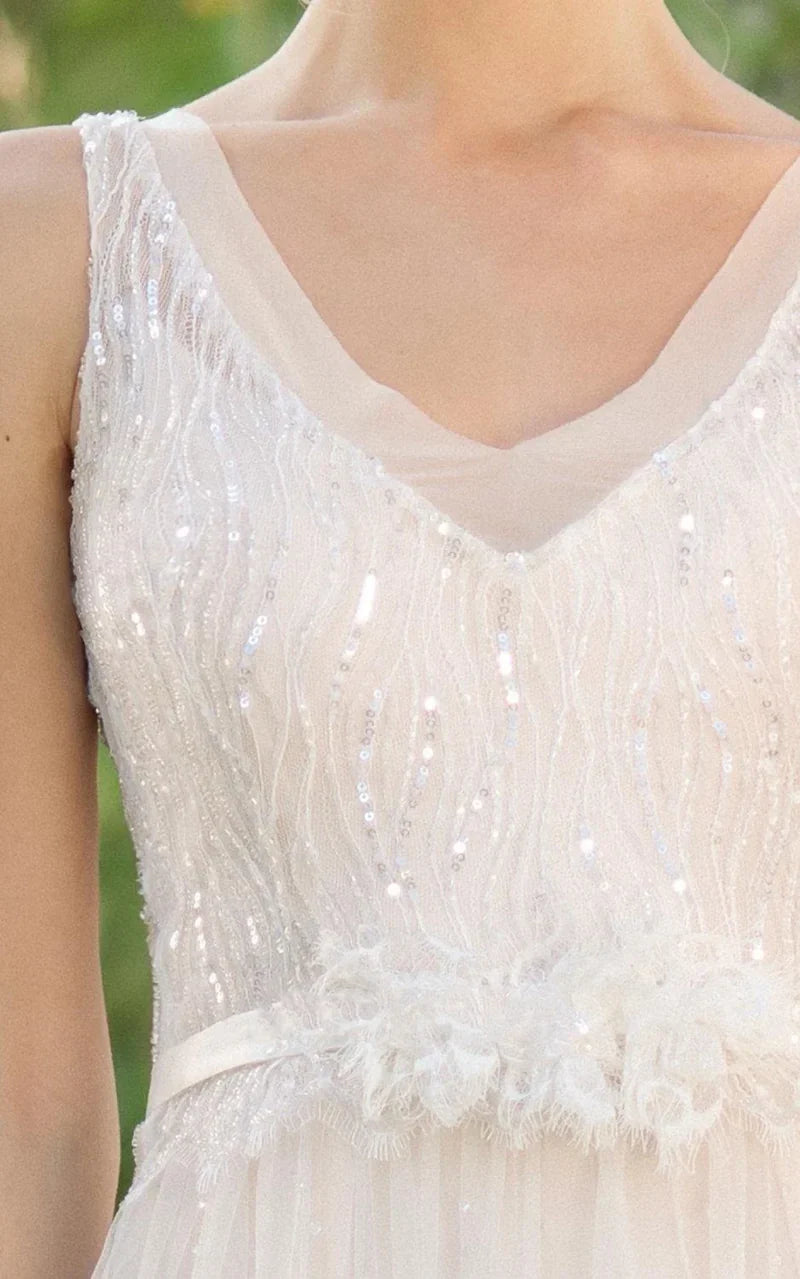 Side view of the elegant A-line wedding gown, showcasing its silhouette and embellishments.