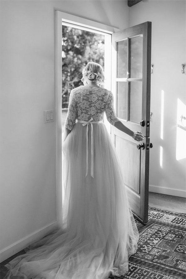 A-line V-neck half sleeve wedding dress with a belt, side view.
