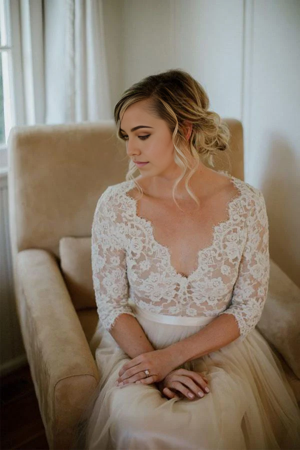 A-line V-neck half sleeve wedding dress with a belt, back view.