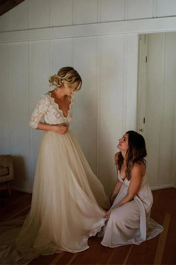 Close-up of the belt and tulle fabric on the A-line V-neck wedding dress.