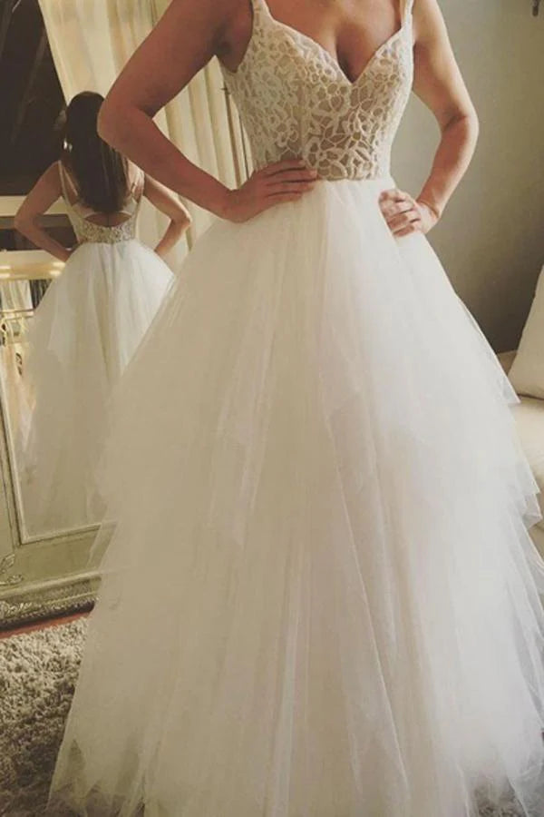 Elegant A-line V-neck wedding dress with lace and appliques.