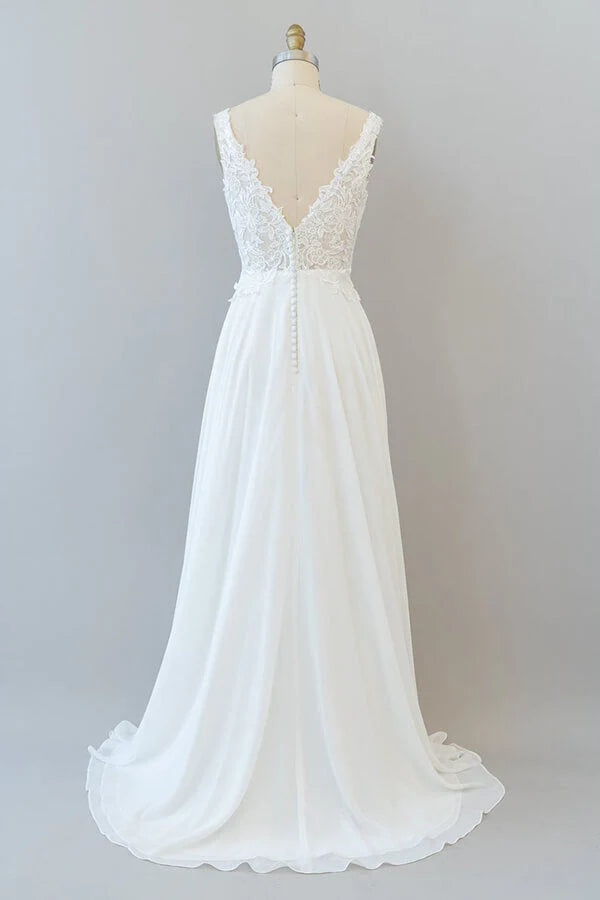 Back view of an A-line V-neck wedding dress with delicate lace details.