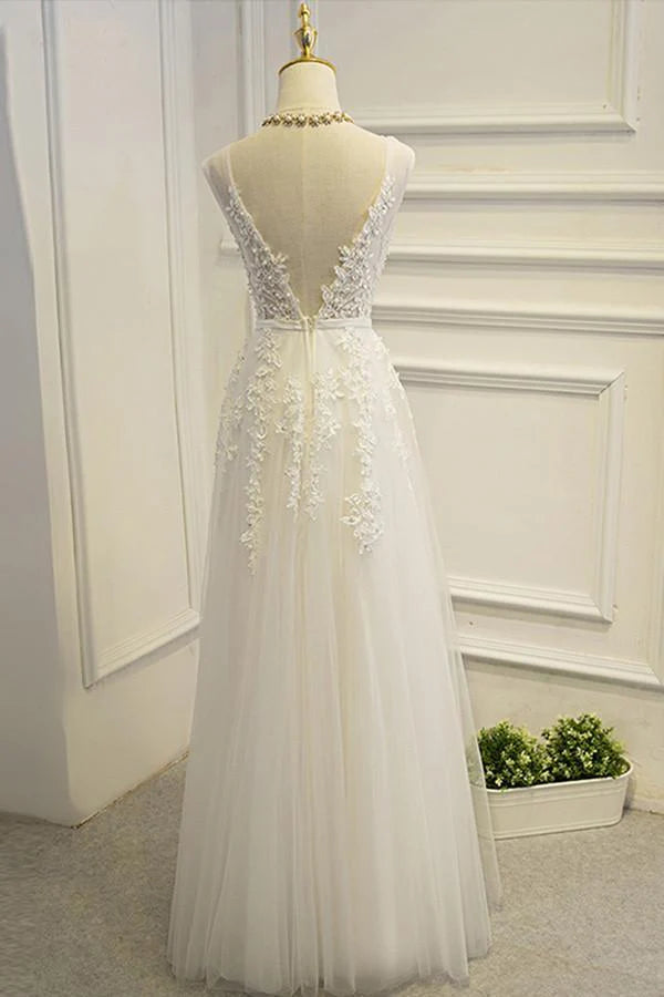 Bride wearing a floor-length A-line lace wedding gown.
