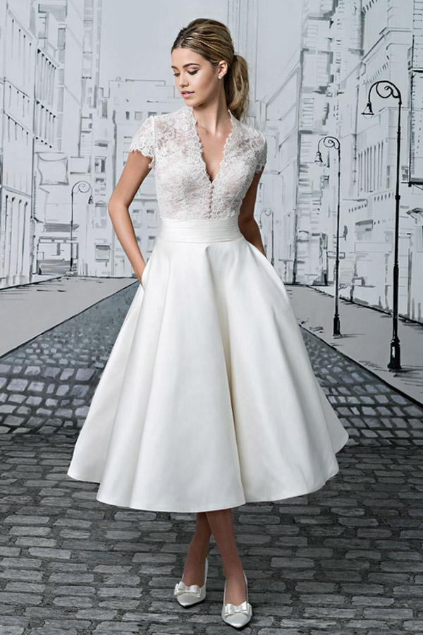 Ivory A-line V-neck lace tea-length wedding dress, front view.