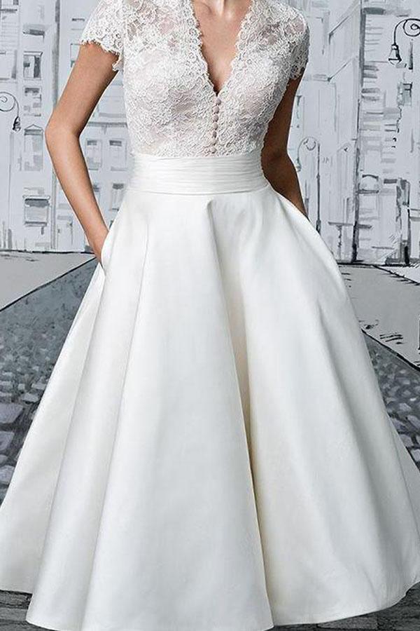 Ivory A-line V-neck lace tea-length wedding dress, full view.