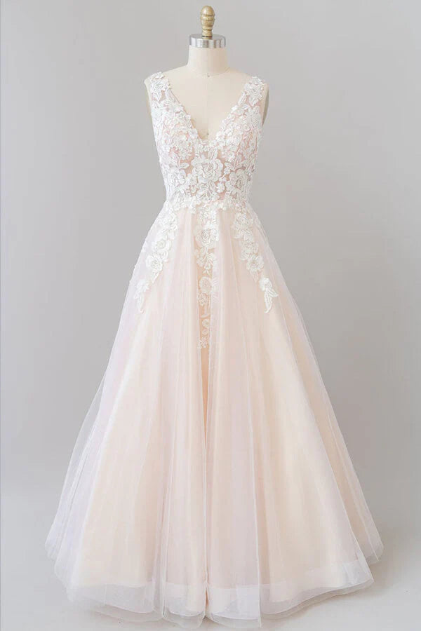 Elegant A-line V-neck wedding dress with lace appliques and a backless design.