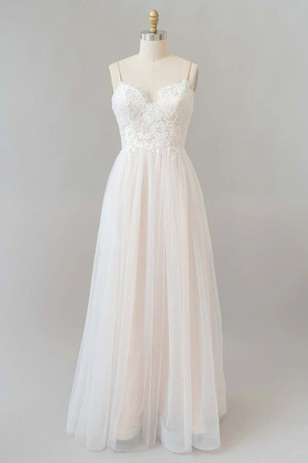 Bride in elegant A-line V-neck lace wedding dress.