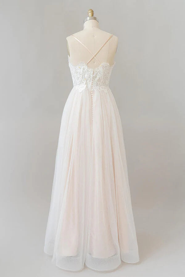 Back view of A-line tulle wedding dress with lace details.