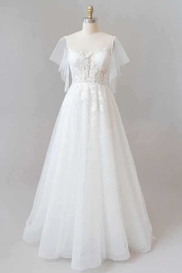 Elegant A-line V-neck lace and tulle wedding dress with long sleeves.