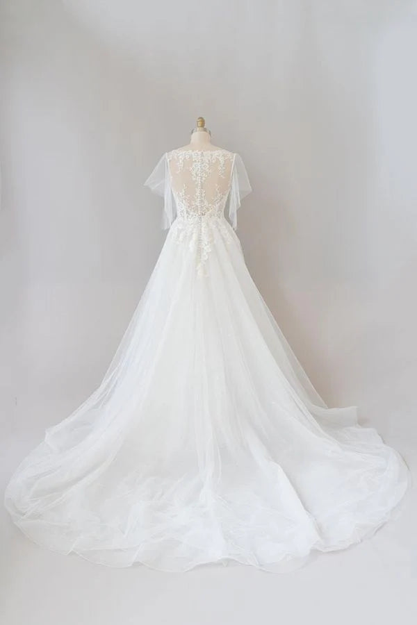 Back view of A-line lace and tulle wedding dress with long sleeves.