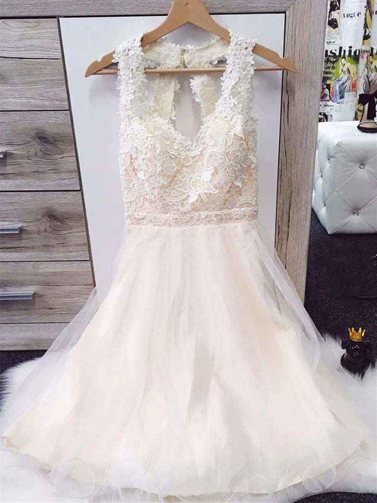 Model wearing an A-line V-neck short lace and tulle prom dress.
