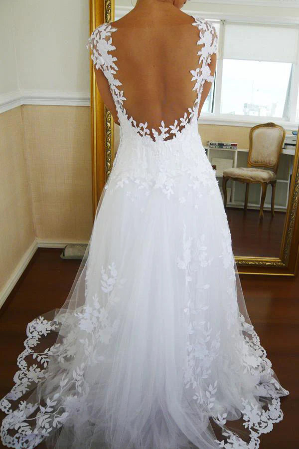Bridal gown featuring A-line silhouette and V-neckline with lace details.