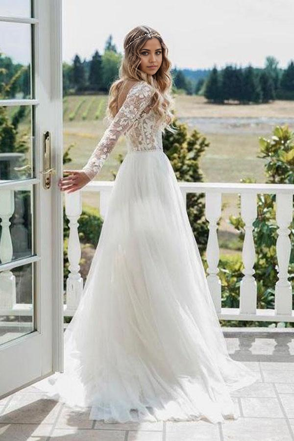 A-line ivory tulle wedding dress with long sleeves and V-neck.