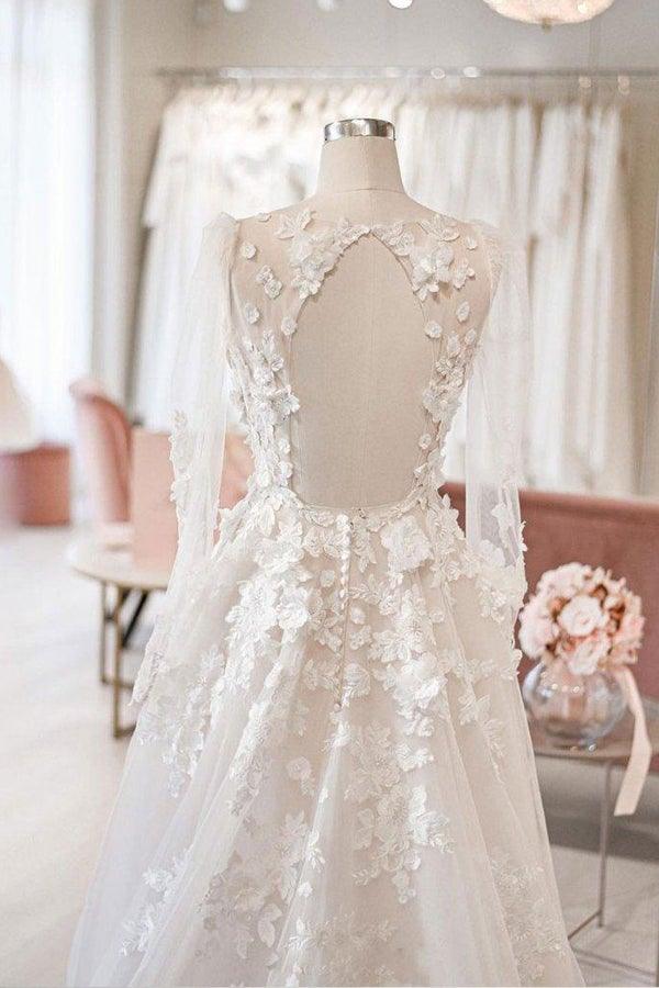 Back view of an ivory A-line wedding dress, showcasing the court train and long sleeves.