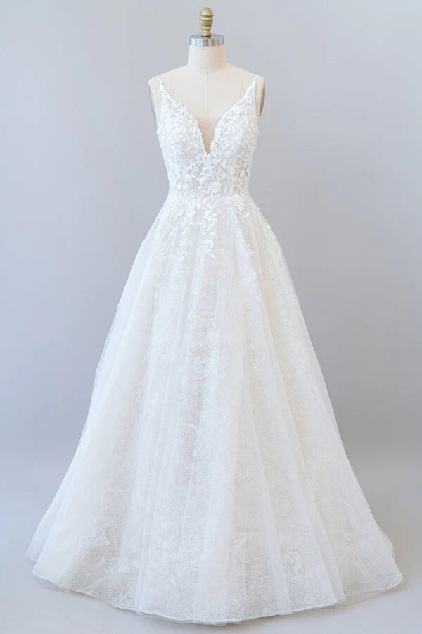 A-line V-neck wedding dress with lace appliques and open back.