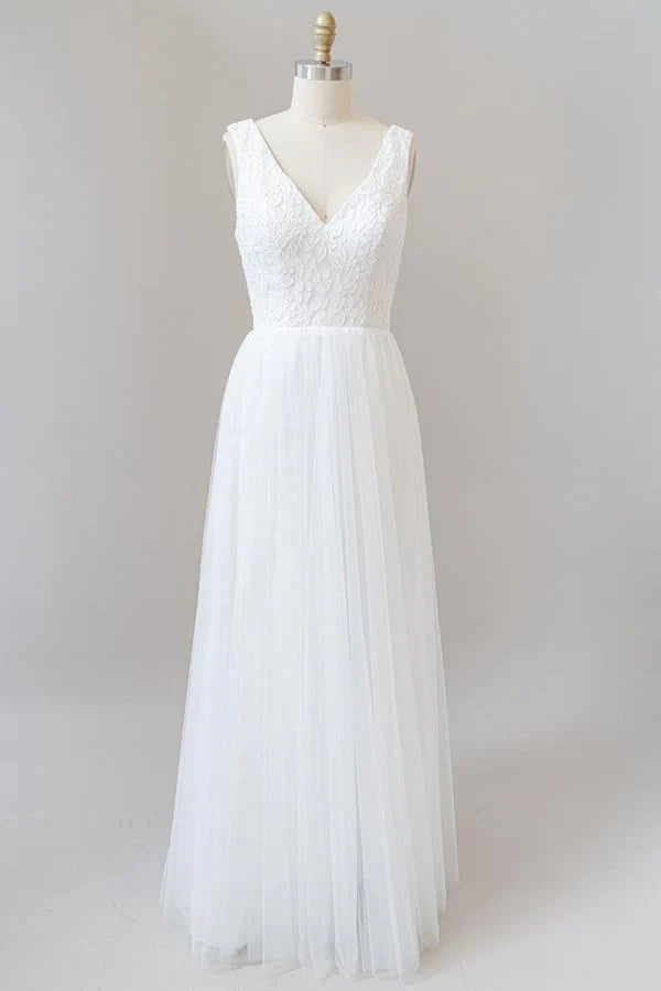 Elegant A-line V-neck lace and tulle wedding dress with open back.
