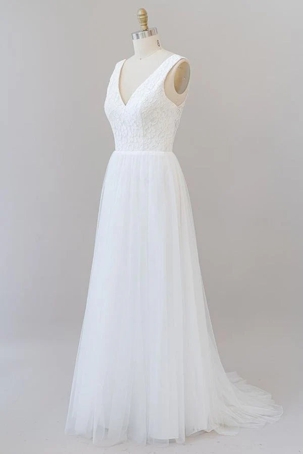 Close-up of lace detailing on the V-neck wedding dress bodice.