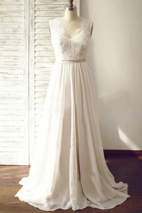Elegant A-line V-neck lace wedding dress with open back and sweep train.