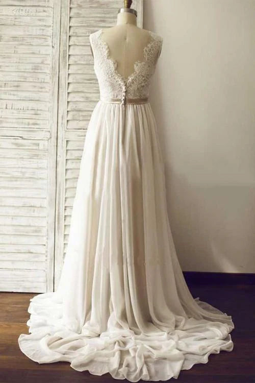 Back view of A-line V-neck lace wedding dress showing open back and sweep train.