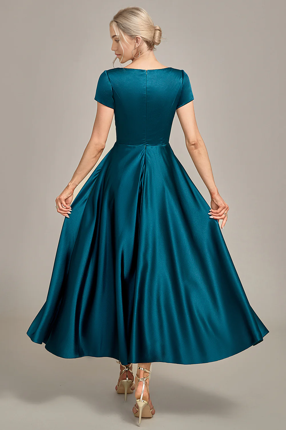 Back view of the peacock blue A-line V-neck pleated satin dress.