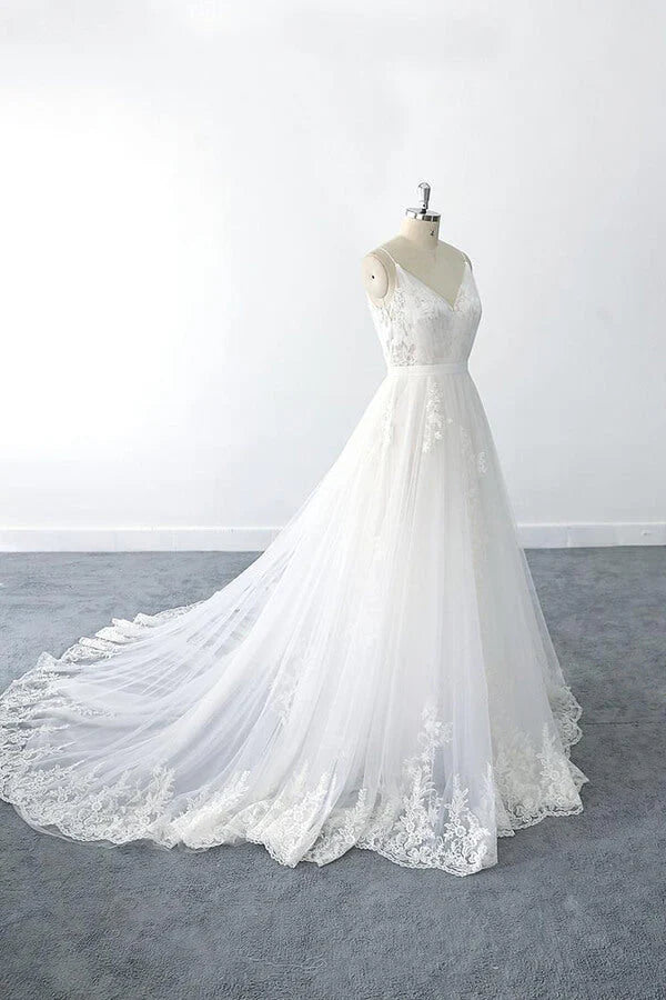 Side view of the A-line tulle wedding dress, highlighting its graceful silhouette.