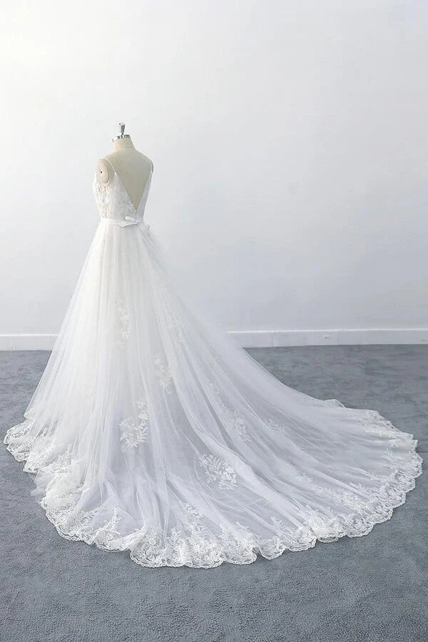 Detail shot of the intricate ruffle appliques and soft tulle fabric on the gown.