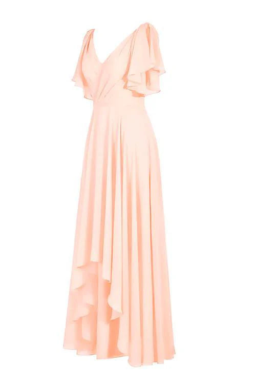 Side view of a woman in a flowing A-line V-neck chiffon bridesmaid gown.